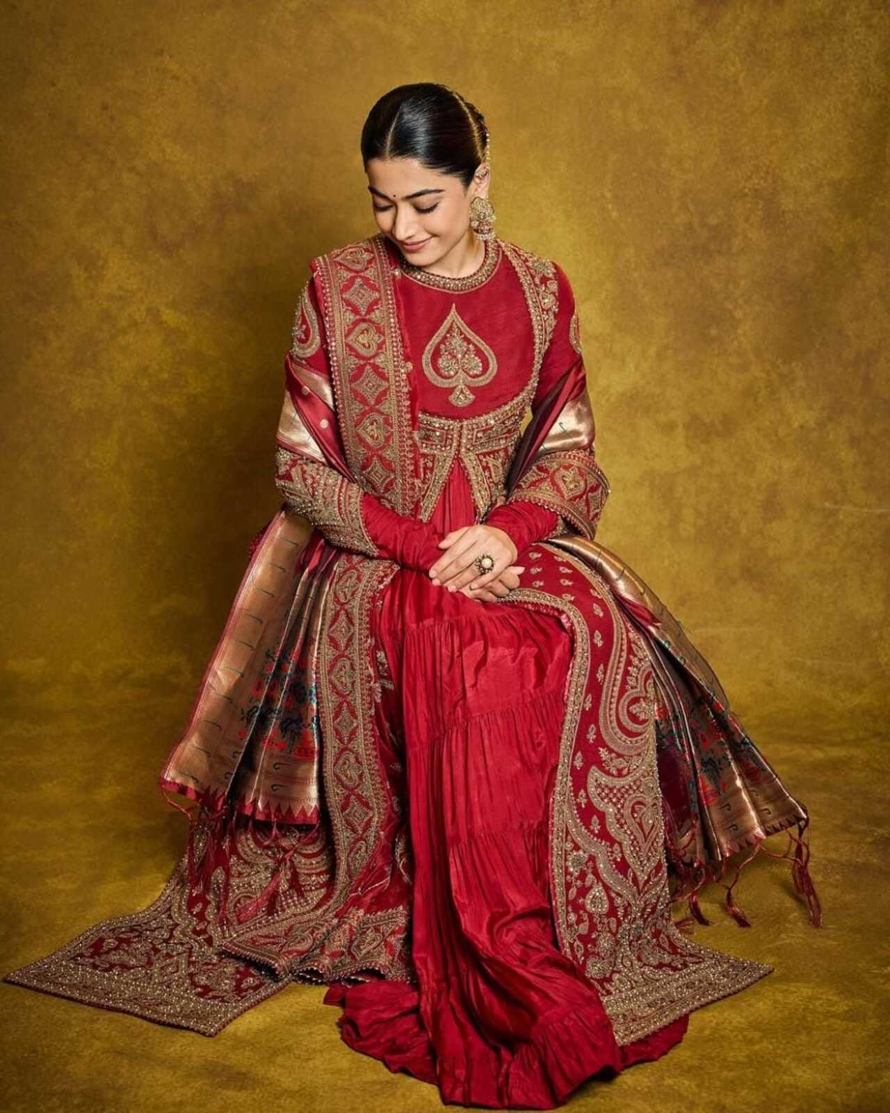 The show-stopper: a deep red heavily embroidered ethnic set with golden zari work and a rich dupatta. Traditional yet powerful, this look radiates goddess-like energy – perfect for invoking Devi vibes during Navratri.